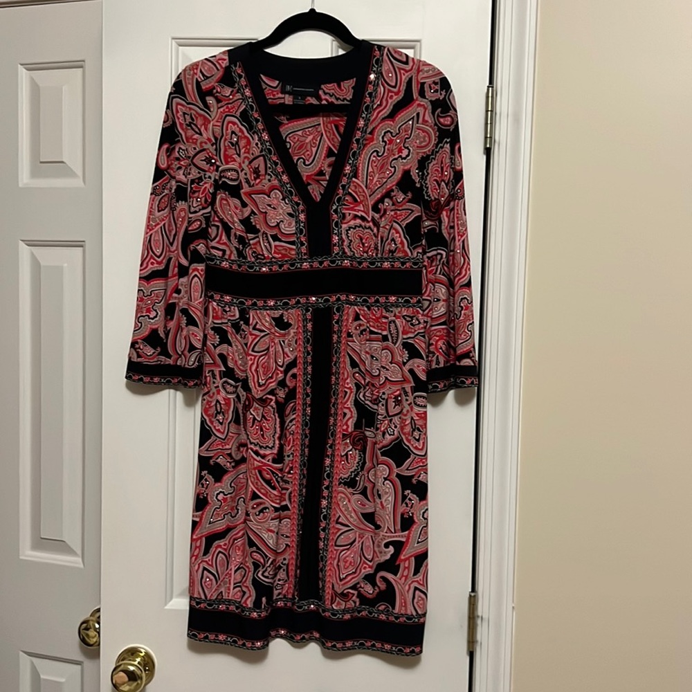 INC international concept paisley red, black mixed with other vibrant colors.